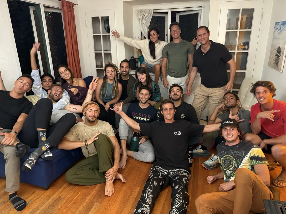 A diverse Improv Playground workshop group smiling together after class