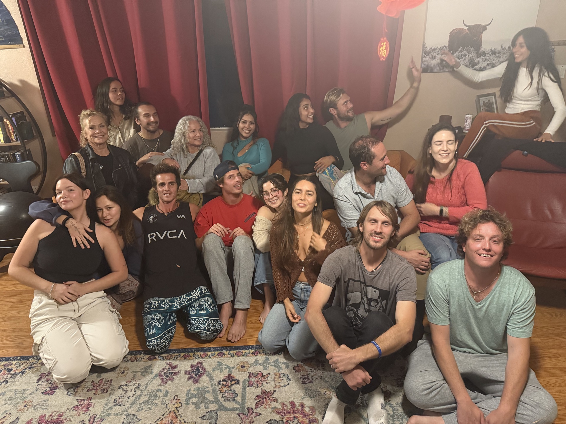 Improv Playground participants laughing together in a warm, casual setting